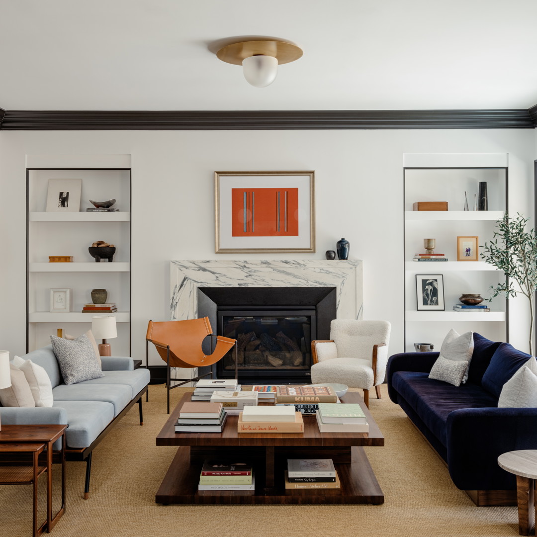 a living room filled with furniture and a fire place