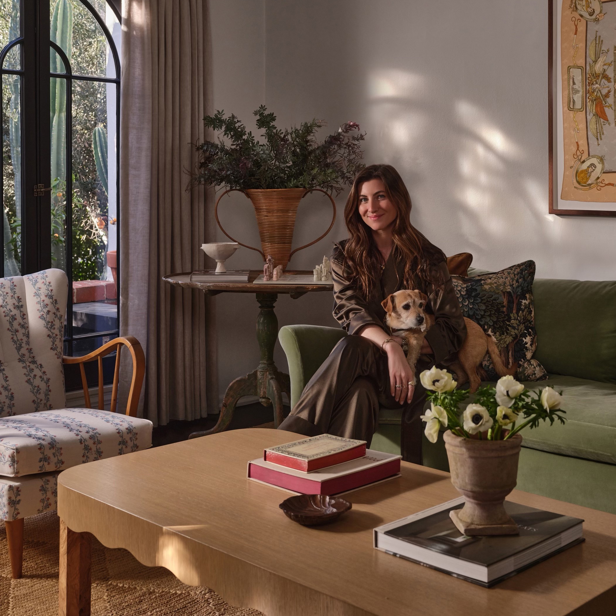 a woman sitting on a couch in a living room