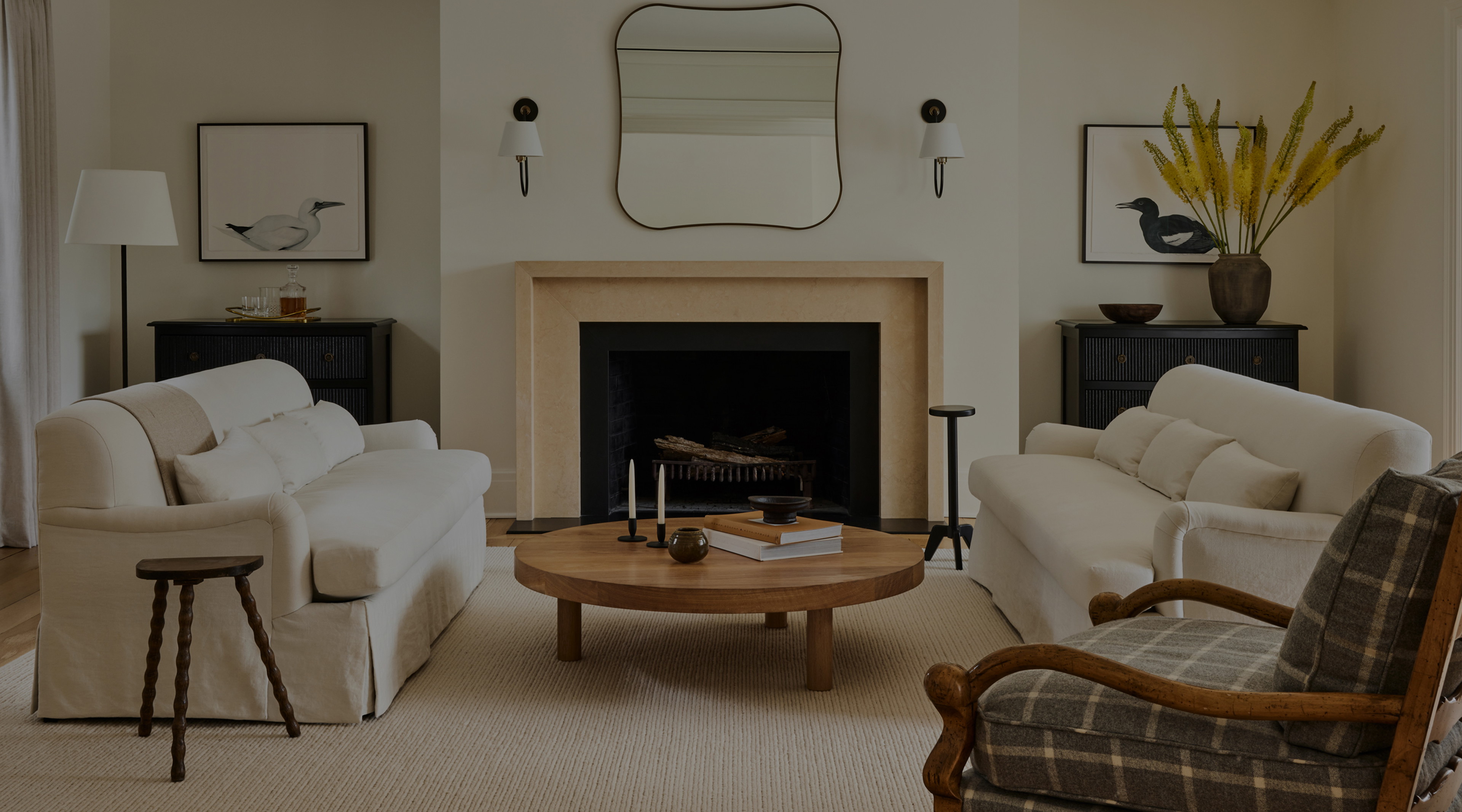 a living room filled with furniture and a fire place