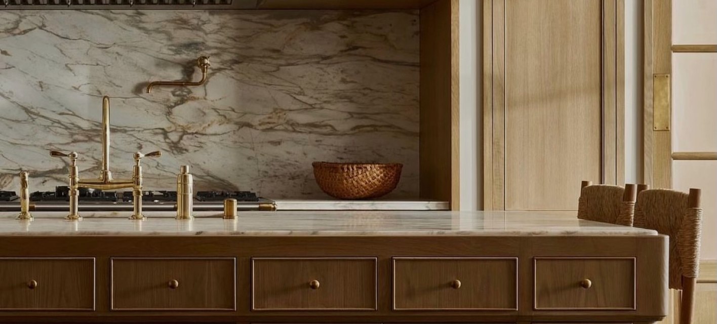 A kitchen counter with a sink and a faucet